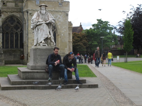 A rare relevant photo: people sitting outside Exeter Cathedral, in front of a statue of someone whose first name is Richard.